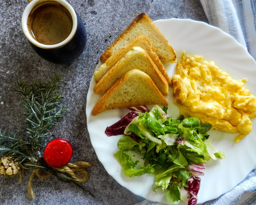 Masala Scrambled Eggs — Free-range eggs, green chilli, cumin, coriander, fresh curry leaves. On sourdough, obviously.