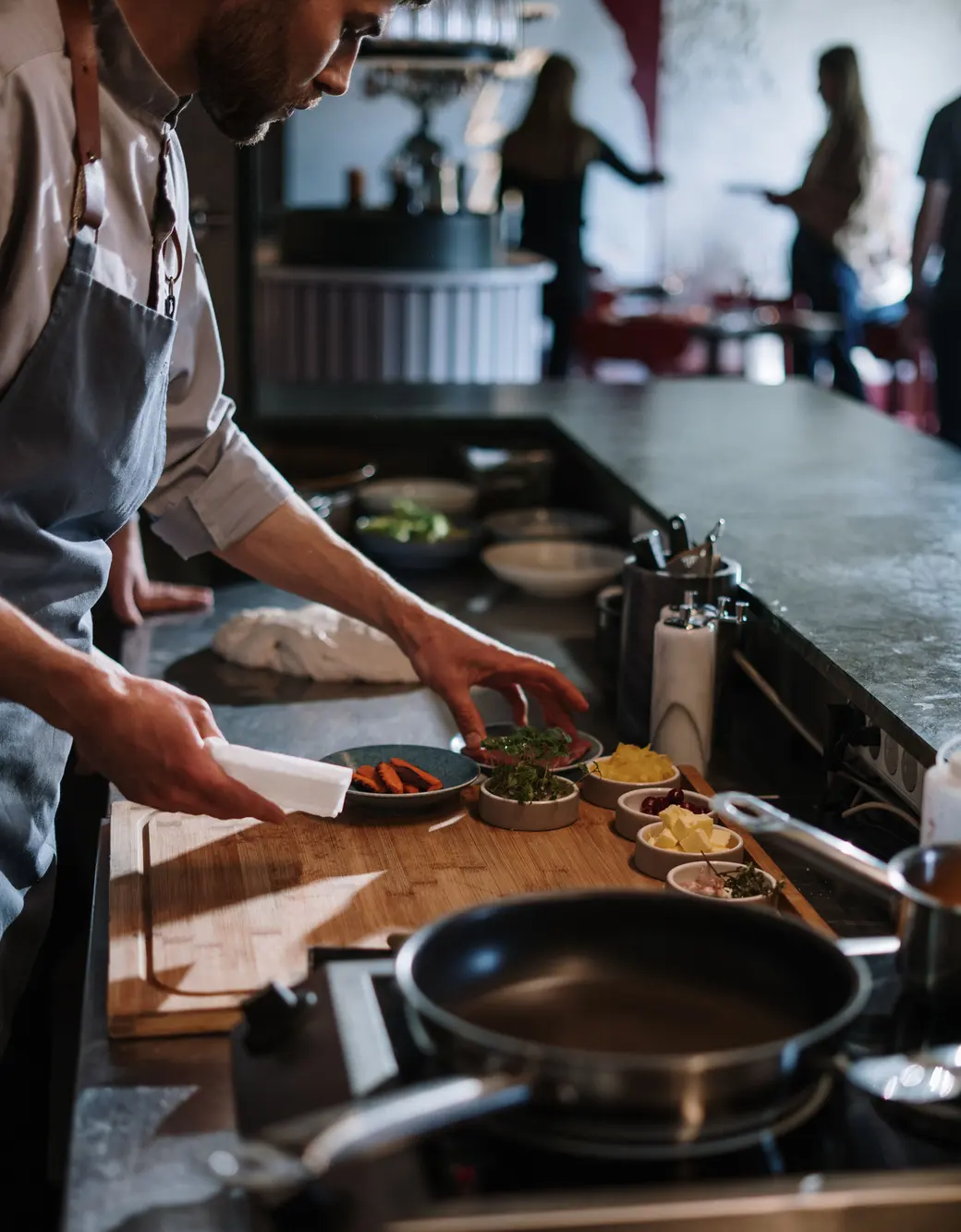 Hands working in a restaurant kitchen